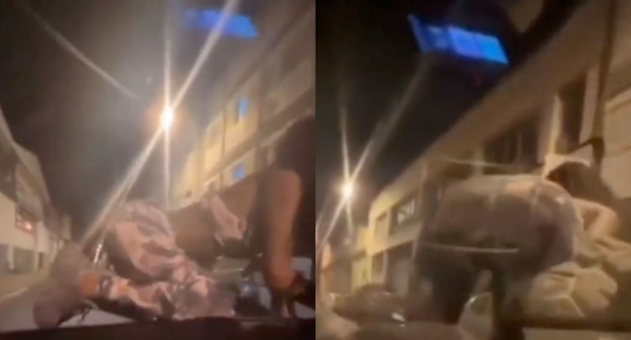 La joven, perreando encima del coche.   @SOCIALDRIVE