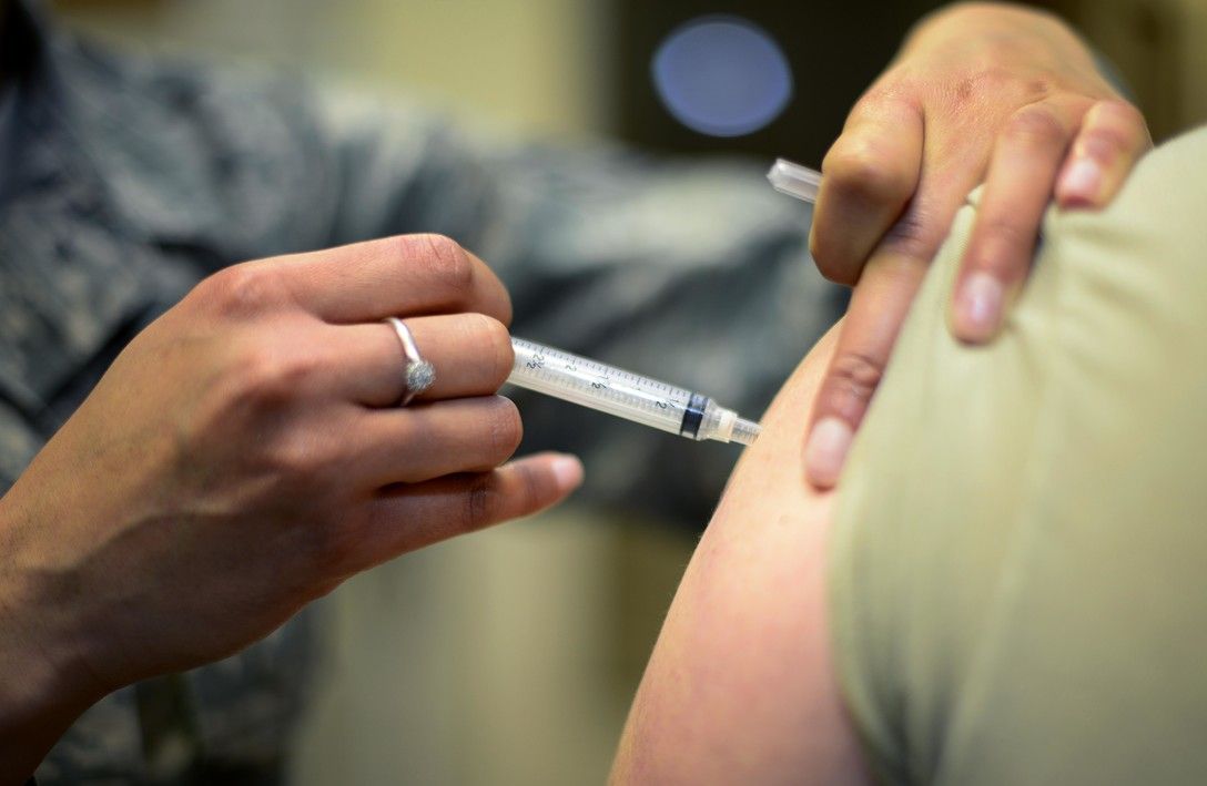 U.S. Air Force Staff Sgt. Bianca Raleigh, 31st Medical Operations Squadron allergy and immunizations noncommissioned officer in charge, administers a patient’s shot March 23, 2015, at Aviano Air Base, Italy. In addition to providing patients with required