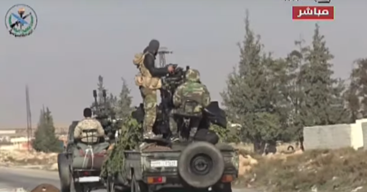 Rebeldes en la entrada hacia Damasco, en una imagen de la televisión pública siria.
