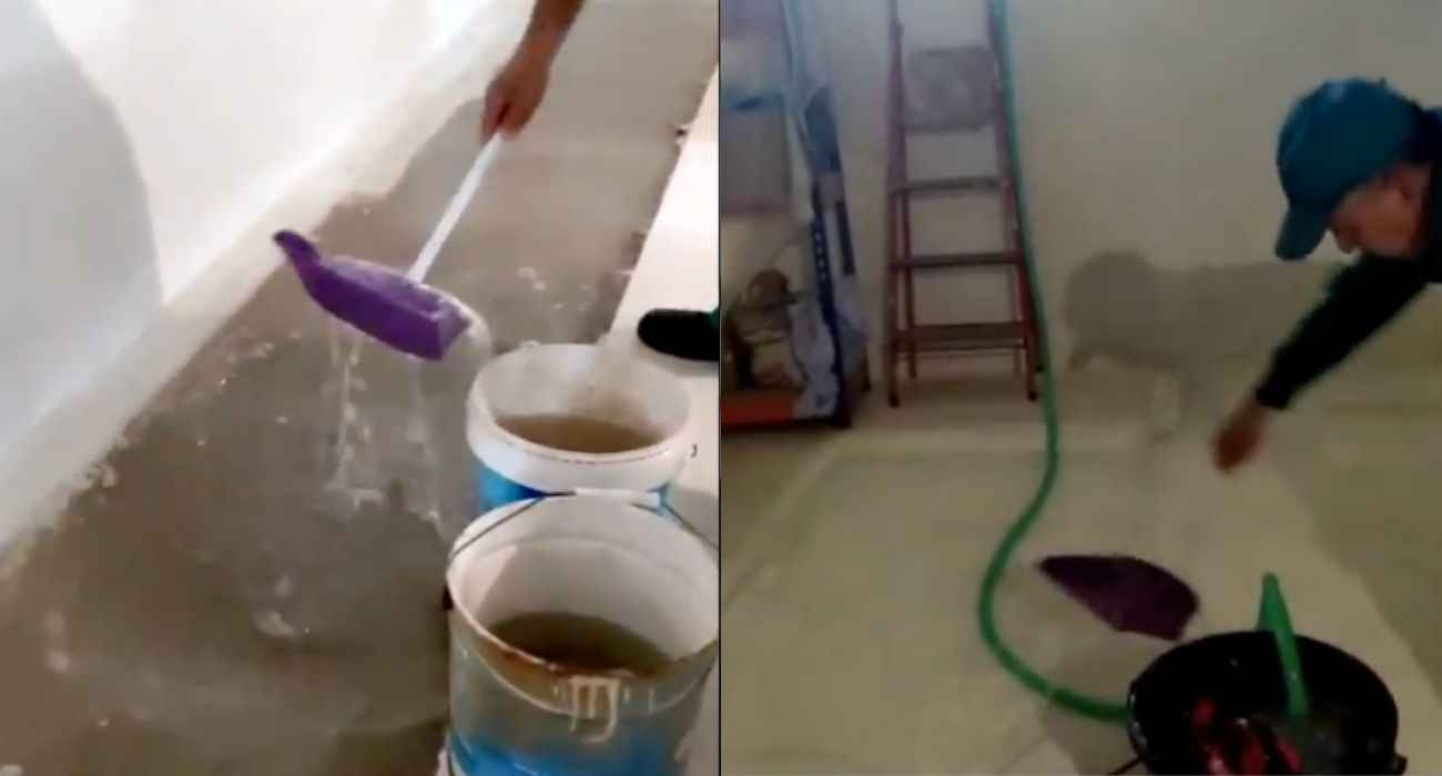 Recogida de agua en la piscina en la que se convierte el sótano cada vez que llueve.