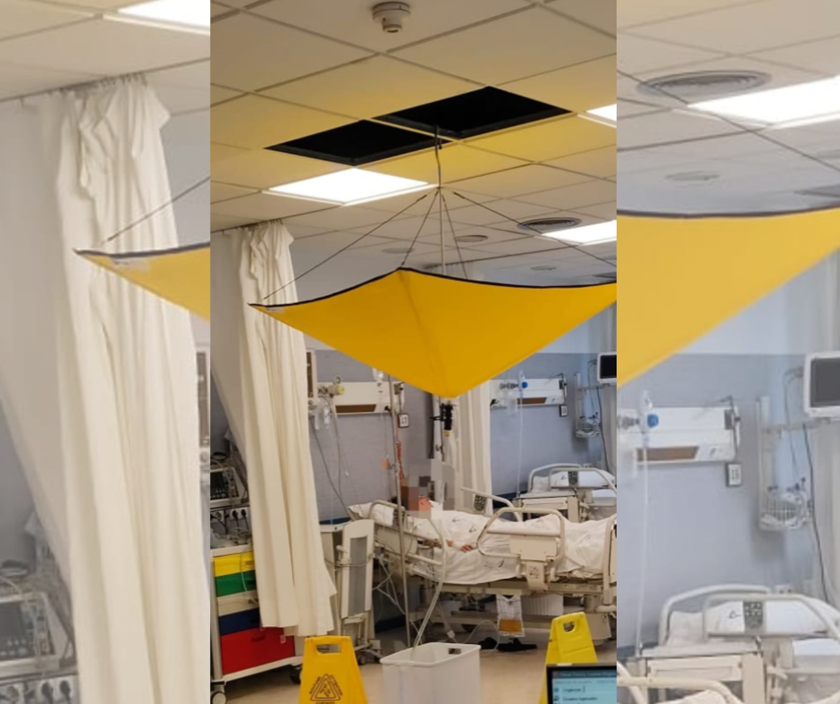 Un paraguas para recoger agua de goteras en el Hospital de Jerez.