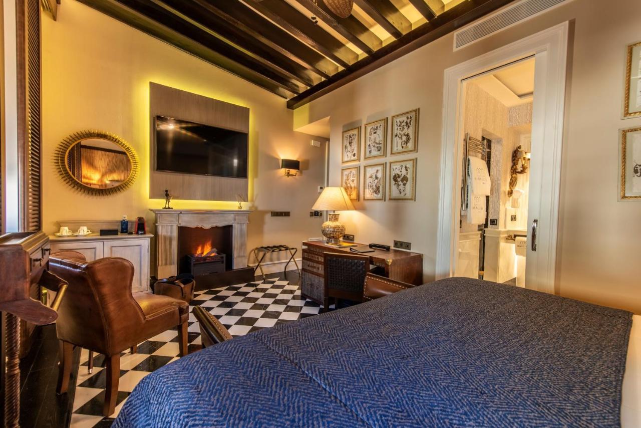 Una de las habitaciones del Hotel Casa Palacio María Luisa, en una imagen del establecimiento de Jerez. Ideal para vivir las Zambombas.
